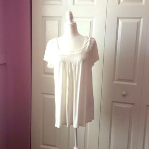 White top with ruched details. Soft and comfy